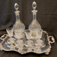 Antique silver plated drinks tray with cut crystal bottles and glasses