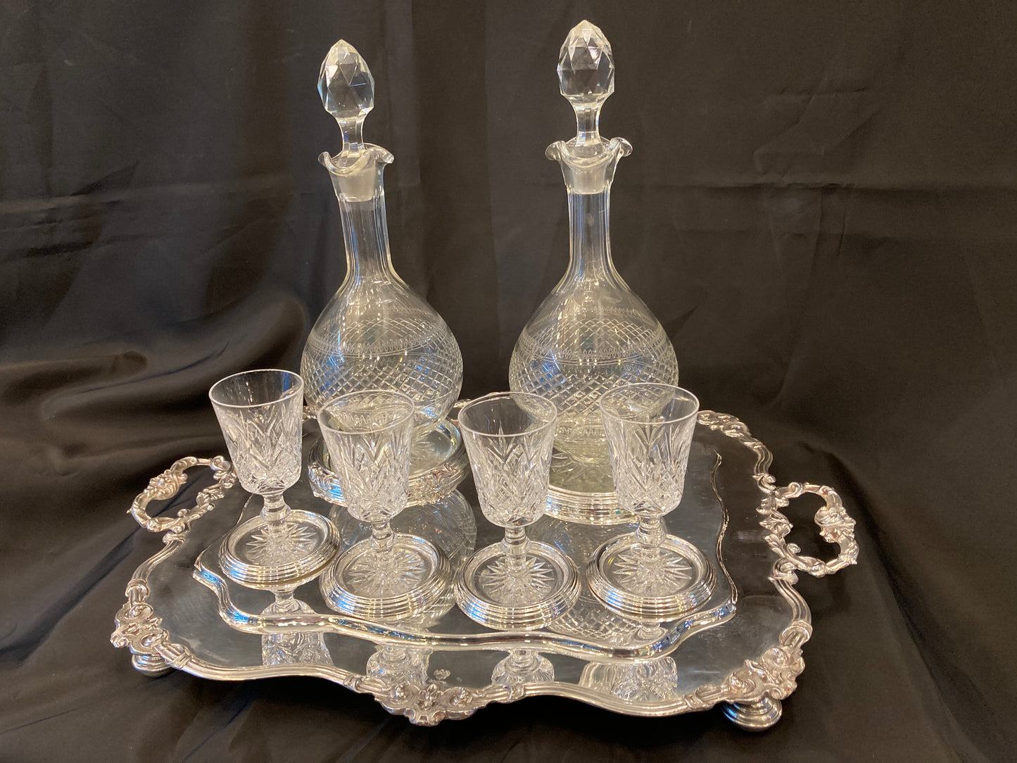 Antique silver plated drinks tray with cut crystal bottles and glasses