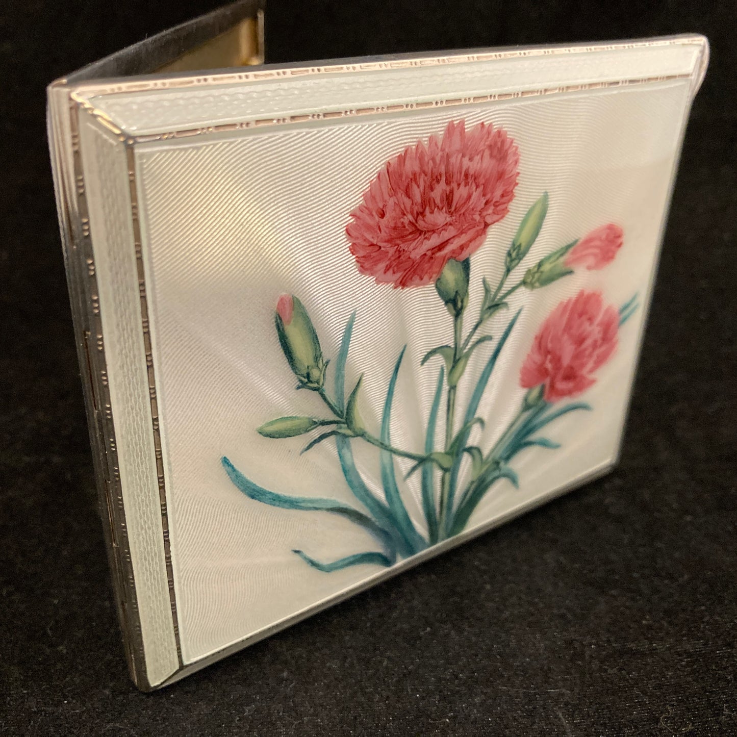 Sterling silver and hand painted guilloche enamel cigarette case.