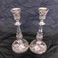 A pair of antique silver plated candlesticks