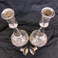 A pair of antique silver plated candlesticks