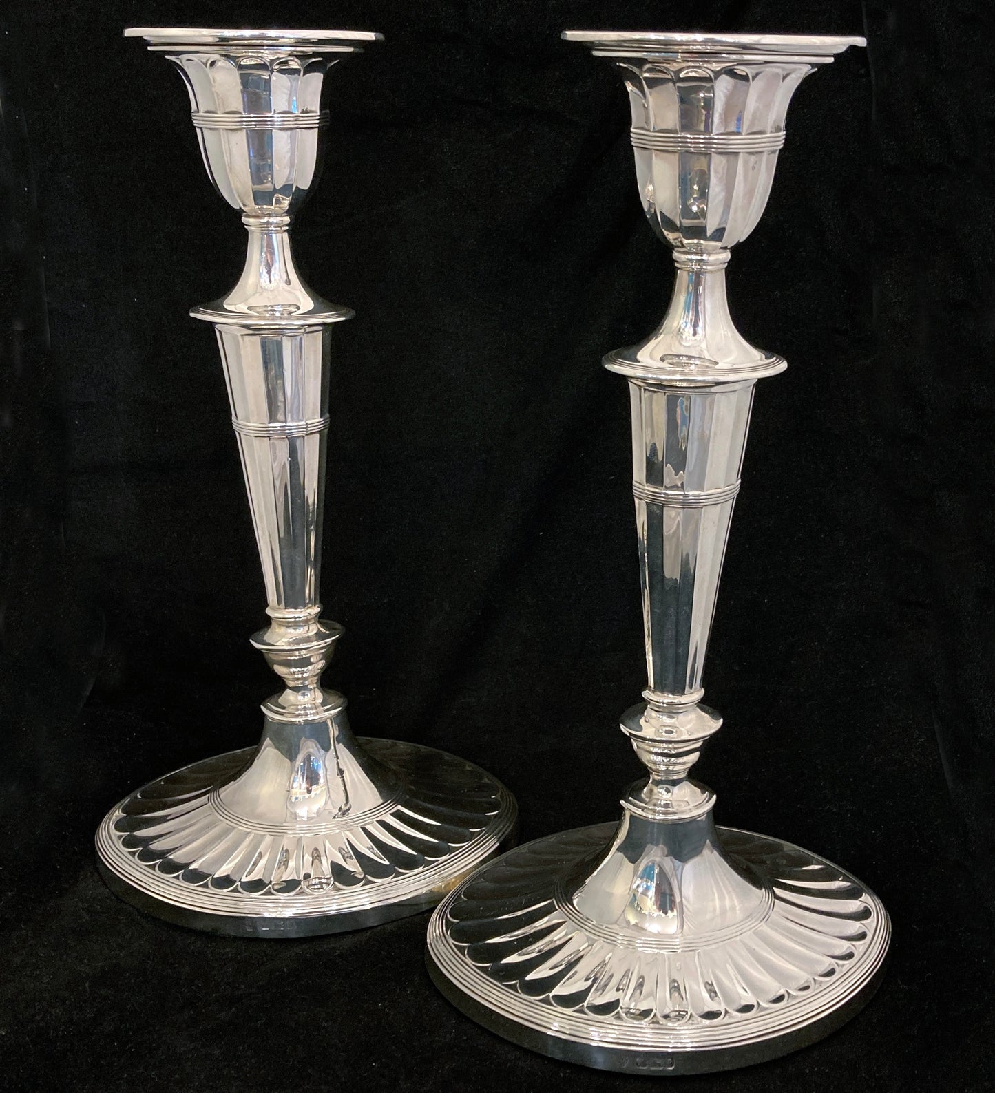 A pair of sterling silver candle sticks By Hanksworth & Eyre