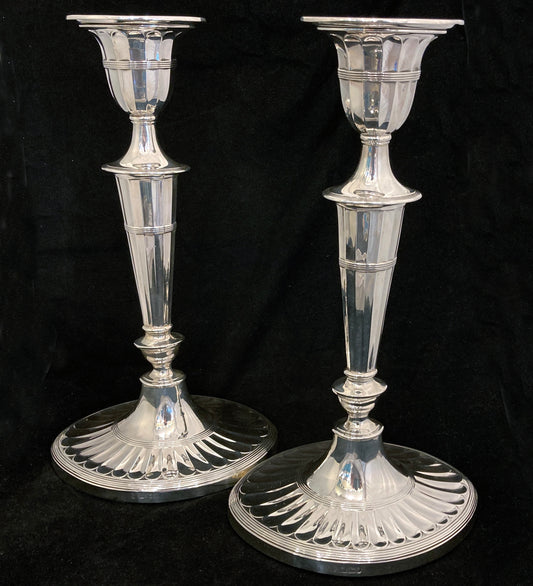 A pair of sterling silver candle sticks By Hanksworth & Eyre