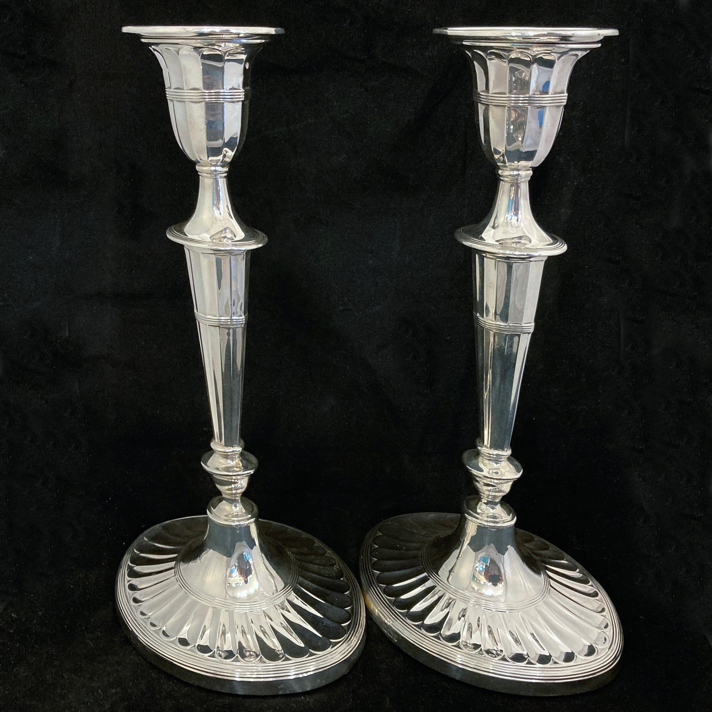 A pair of sterling silver candle sticks By Hanksworth & Eyre