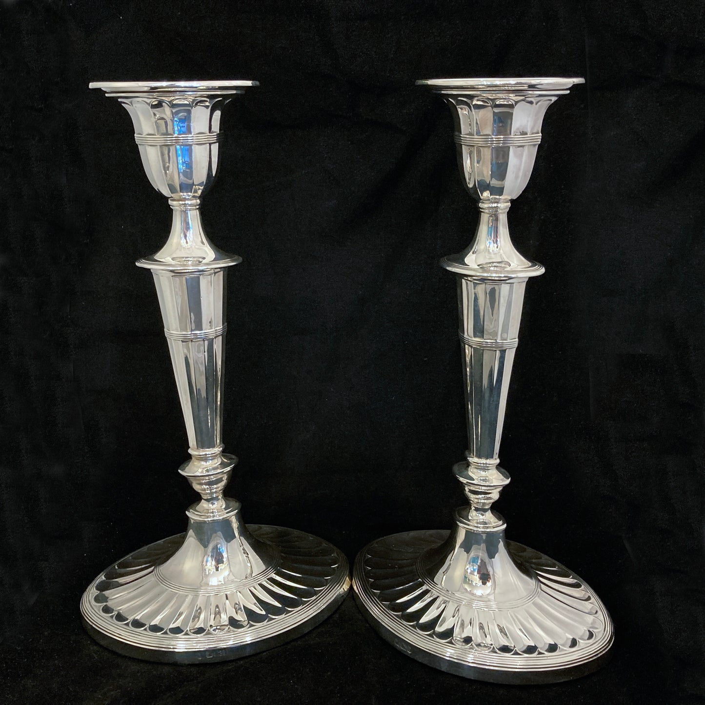 A pair of sterling silver candle sticks By Hanksworth & Eyre