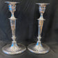 A pair of sterling silver candle sticks By Hanksworth & Eyre