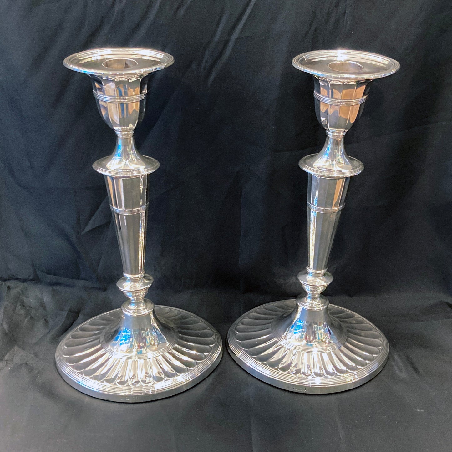 A pair of sterling silver candle sticks By Hanksworth & Eyre