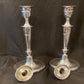 A pair of sterling silver candle sticks By Hanksworth & Eyre