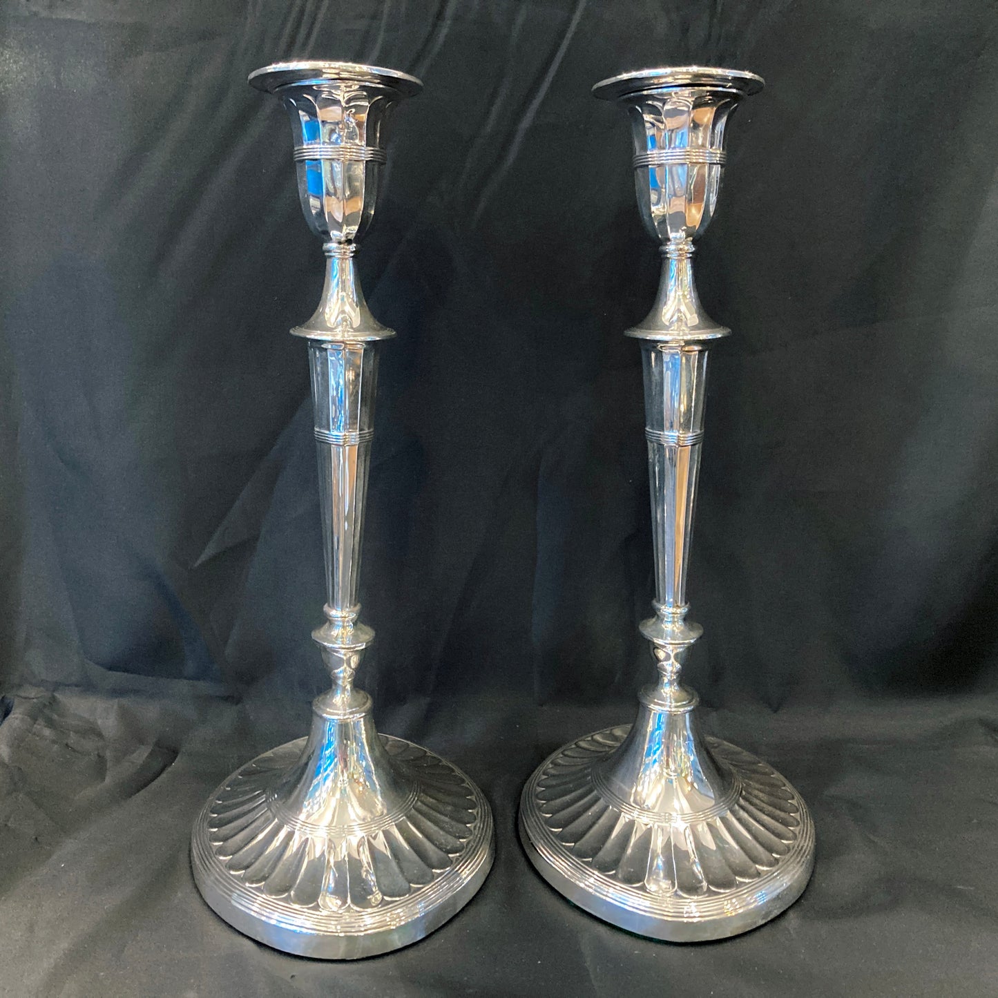 A pair of sterling silver candle sticks By Hanksworth & Eyre