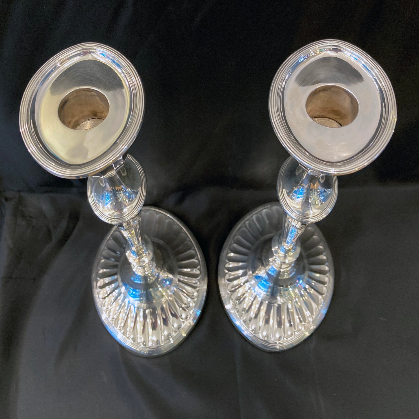 A pair of sterling silver candle sticks By Hanksworth & Eyre