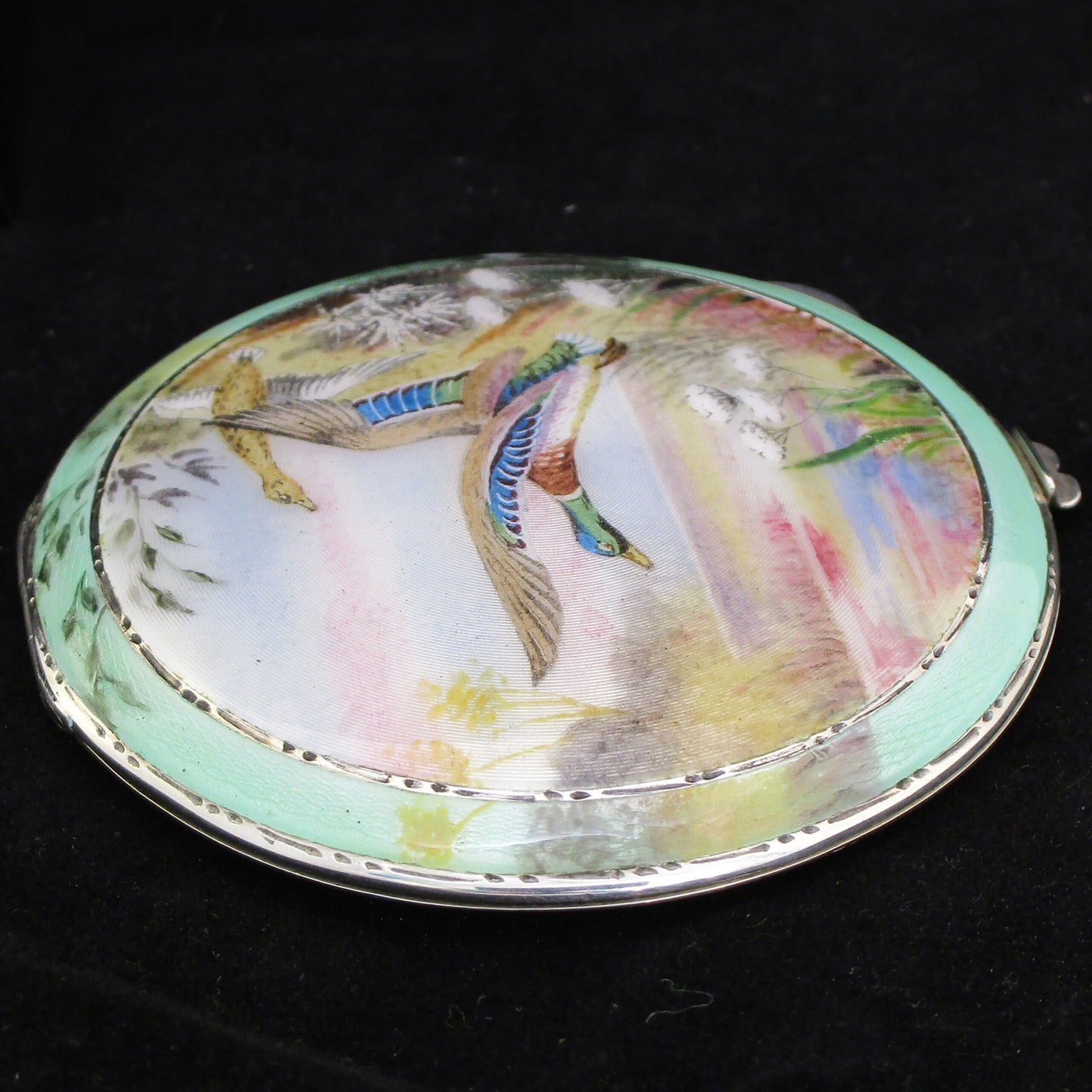 Silver and enamel compact with hand painted ducks.