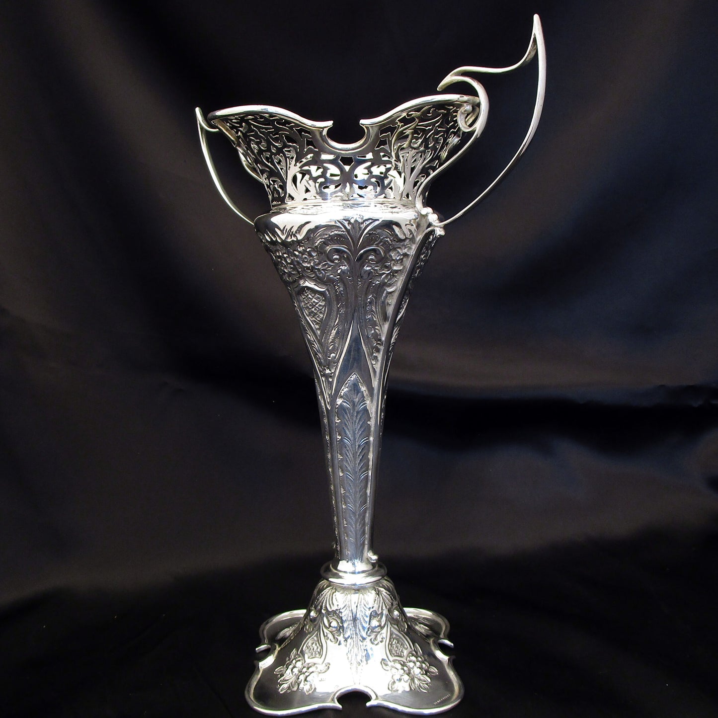 A pair of large sterling silver pierced and embossed vases by Walker & Hall.