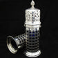 A rare pair of silver sugar shakers with blue liners.