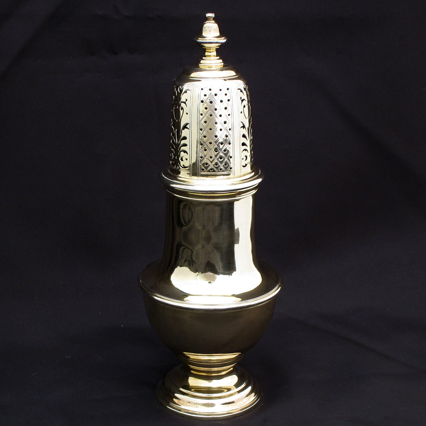 Rare giant gilded sugar shaker.