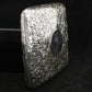 Chased silver cigarette case.