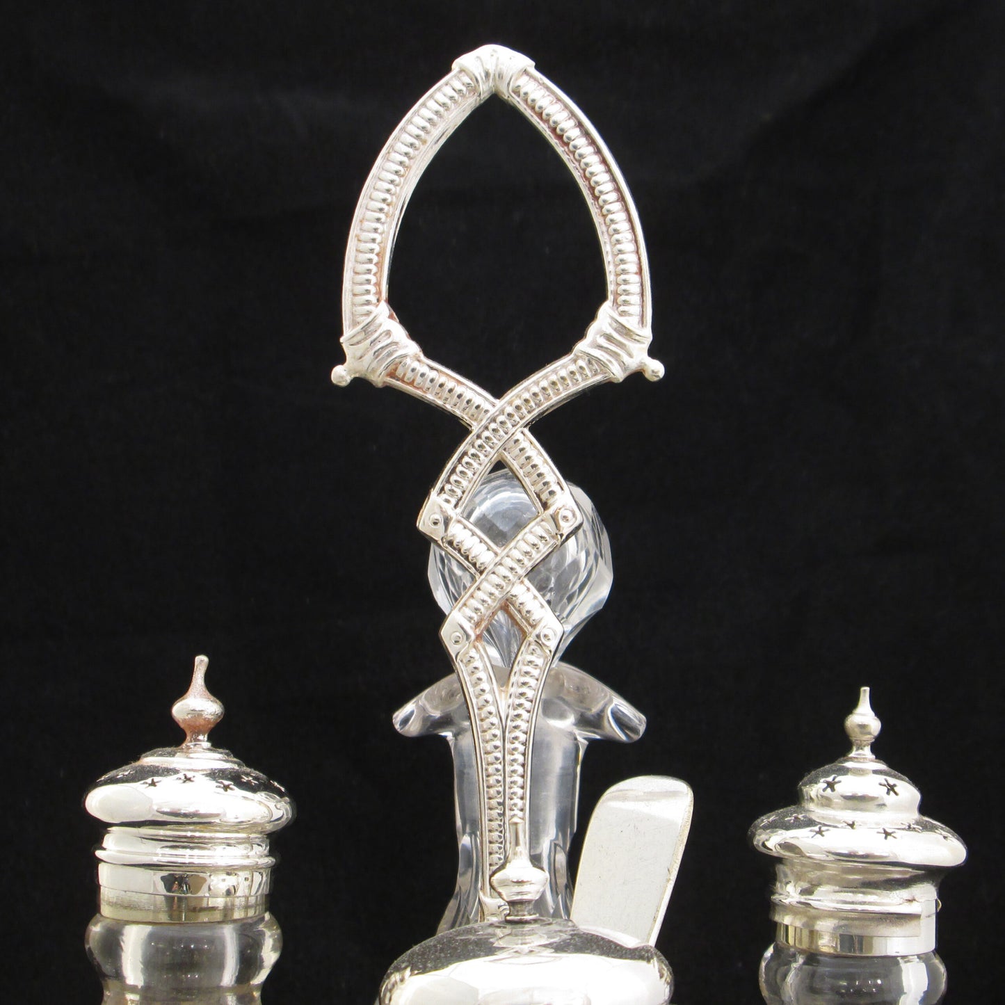 Silver plated cruet set in gallery base.