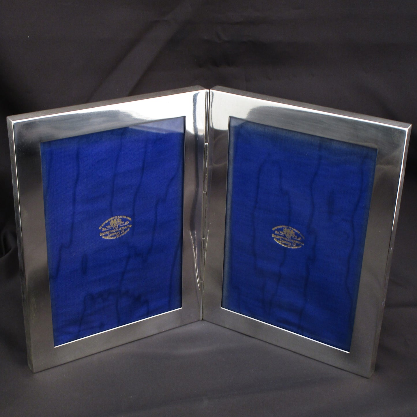 A wonderfull rare double photo frame by Goldsmiths & Silversmiths Co.