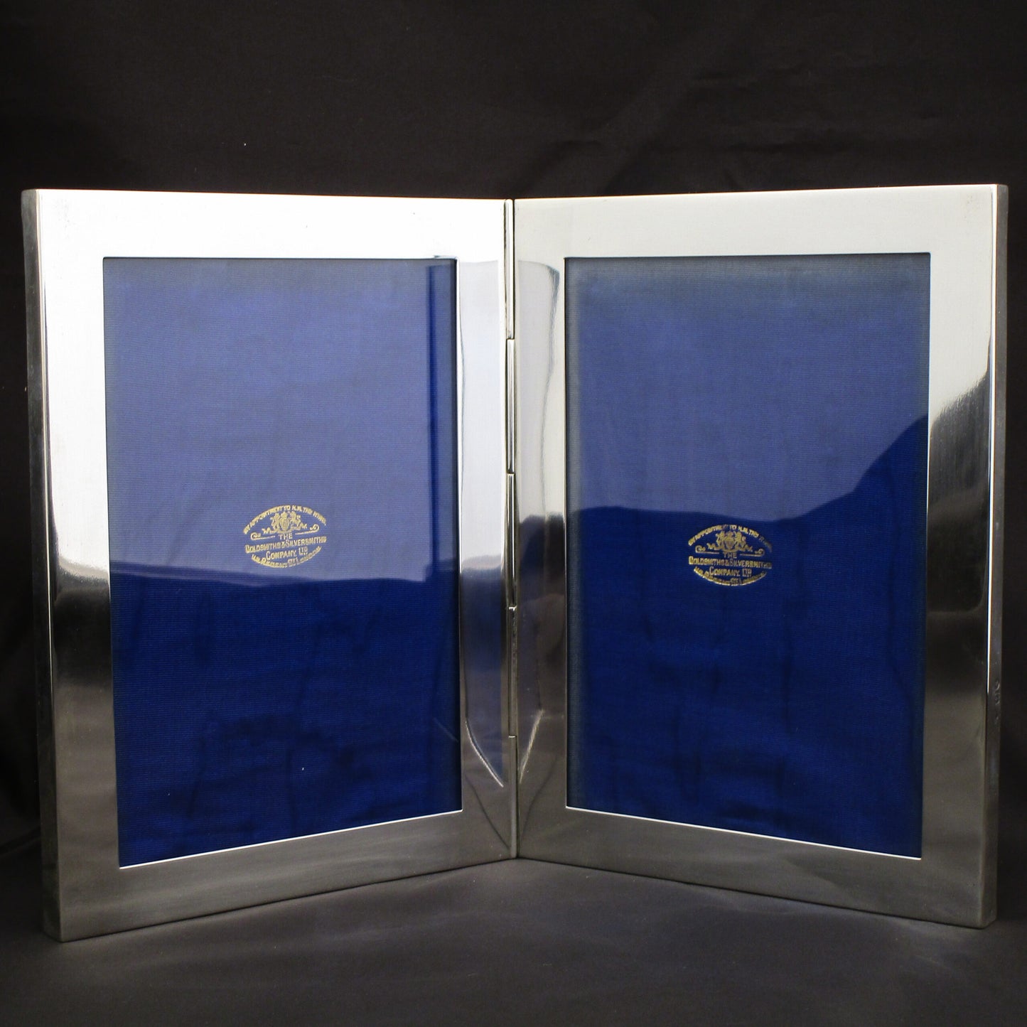 A wonderfull rare double photo frame by Goldsmiths & Silversmiths Co.