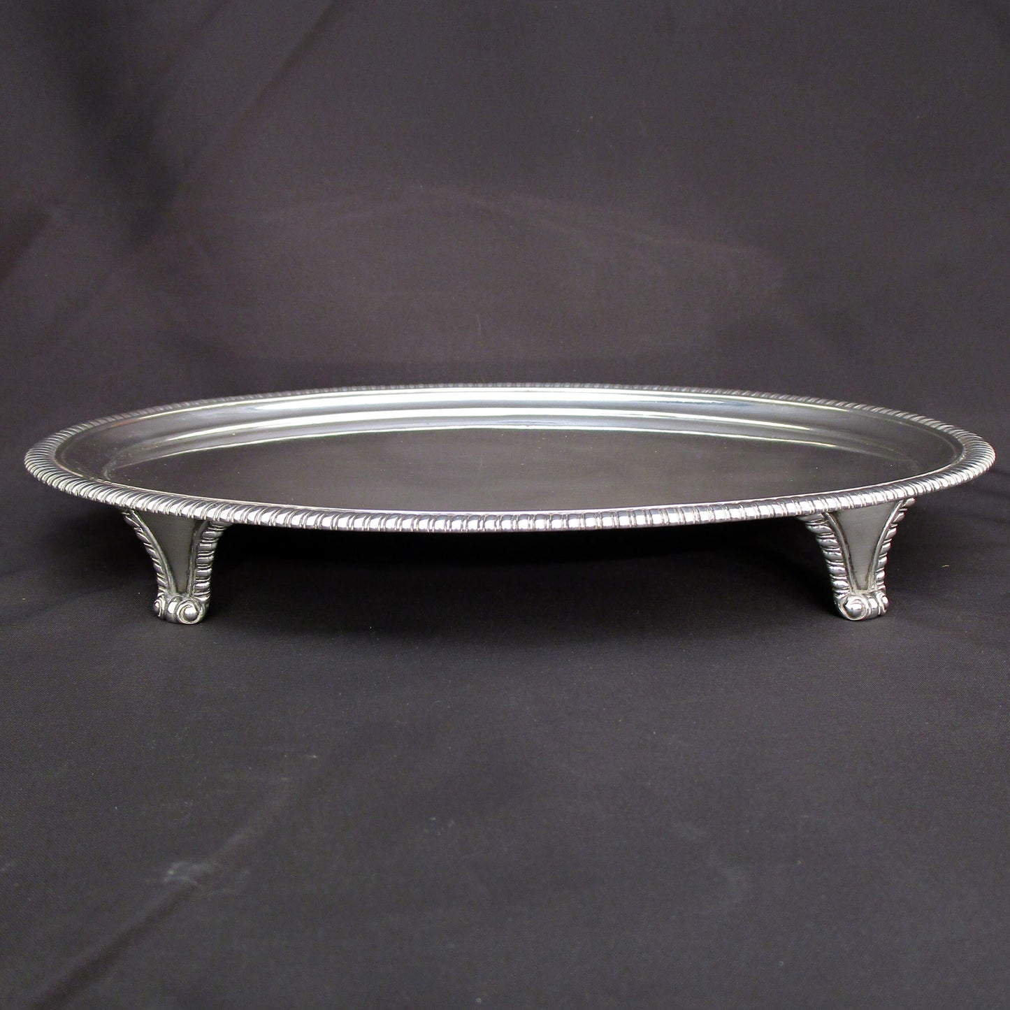 A Georgian oval gadrooned border sterling silver salva / drinks tray.
