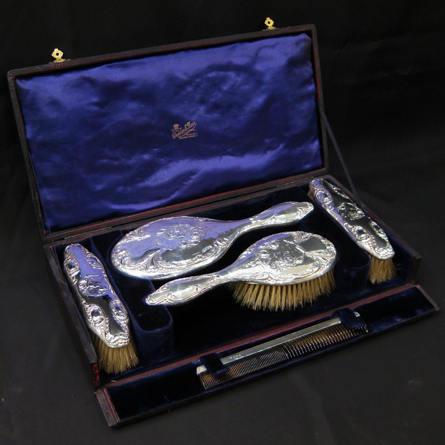 An art nouveau silver vanity set by Mitchell Bosley