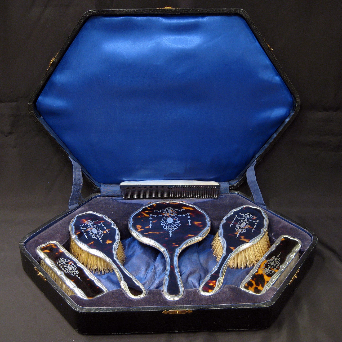 A boxed vanity set by Hasset and Harper