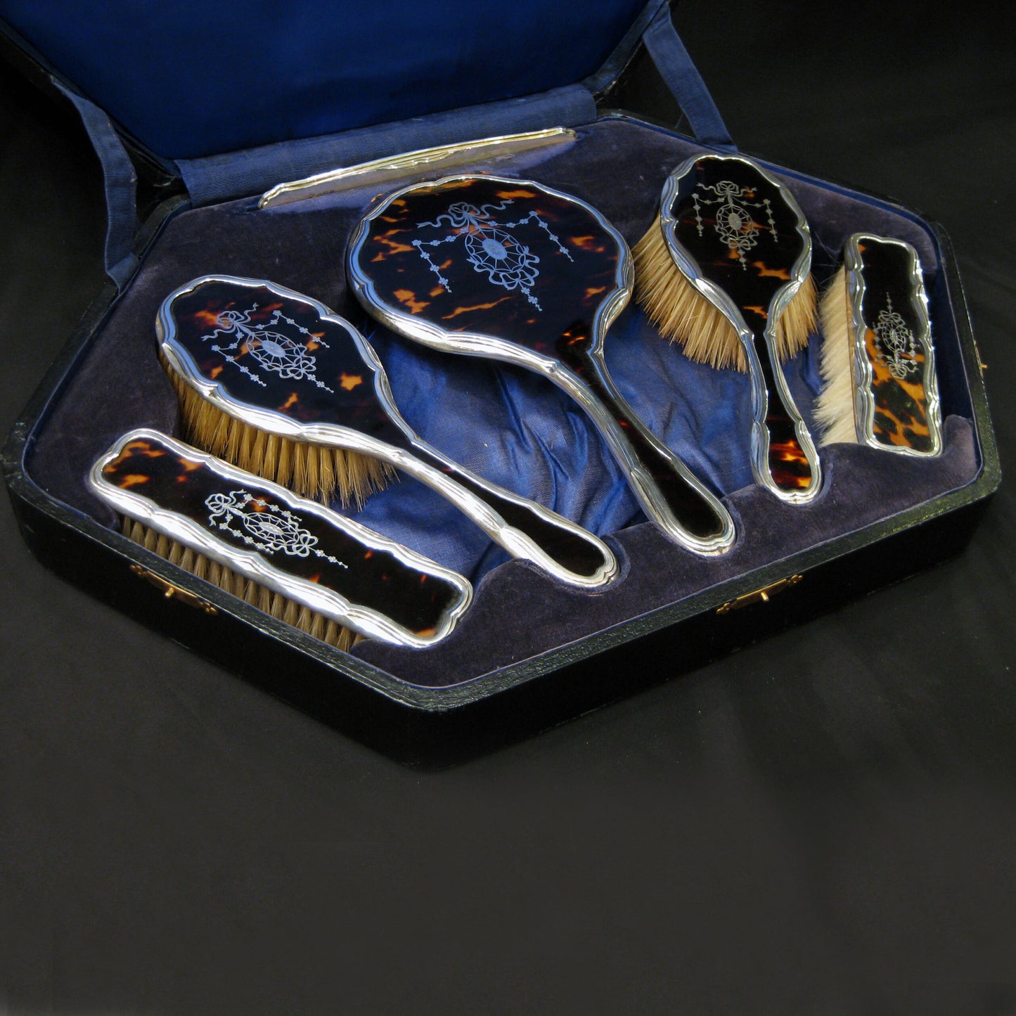 A boxed vanity set by Hasset and Harper