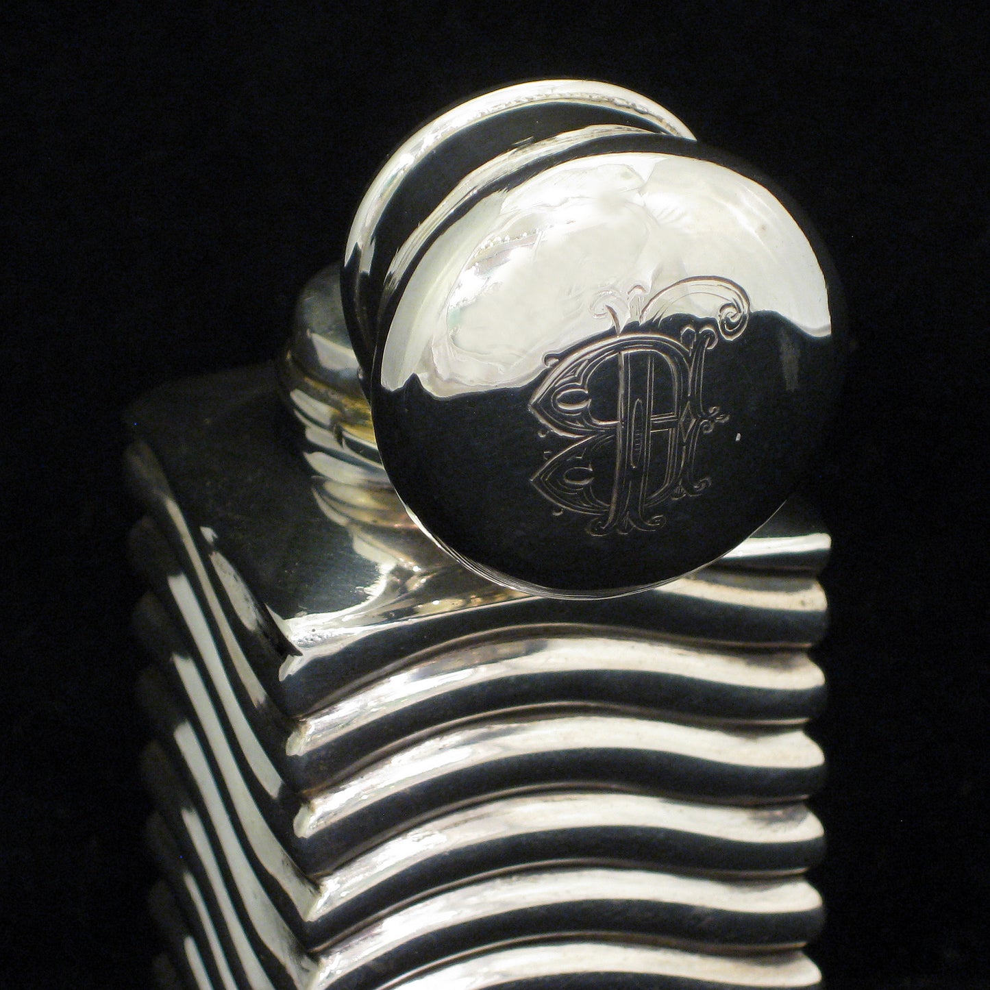 A rare unusually shaped silver perfume bottle