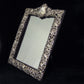 Sterling silver ornate table mirror/picture frame.