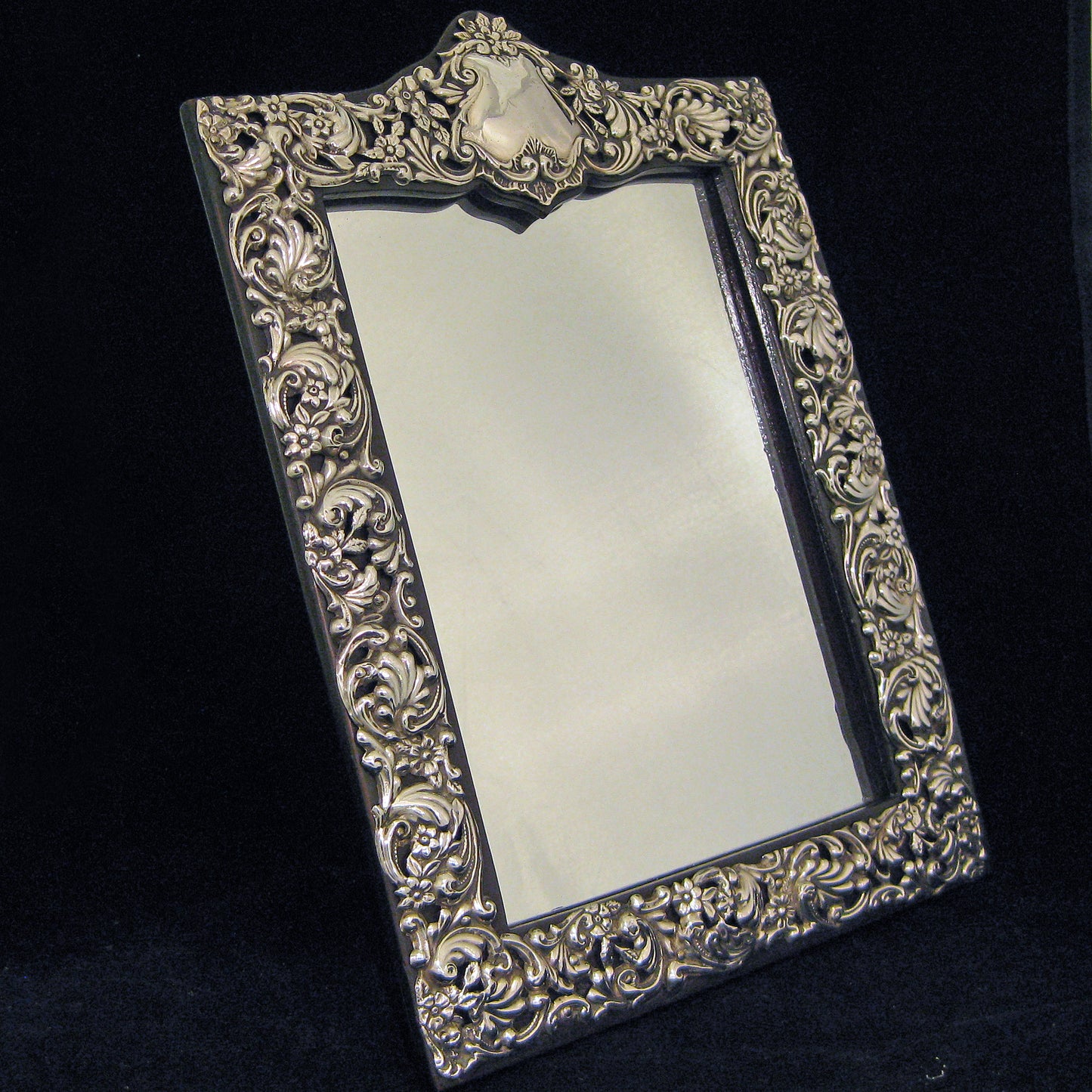 Sterling silver ornate table mirror/picture frame.