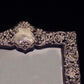 Sterling silver ornate table mirror/picture frame.