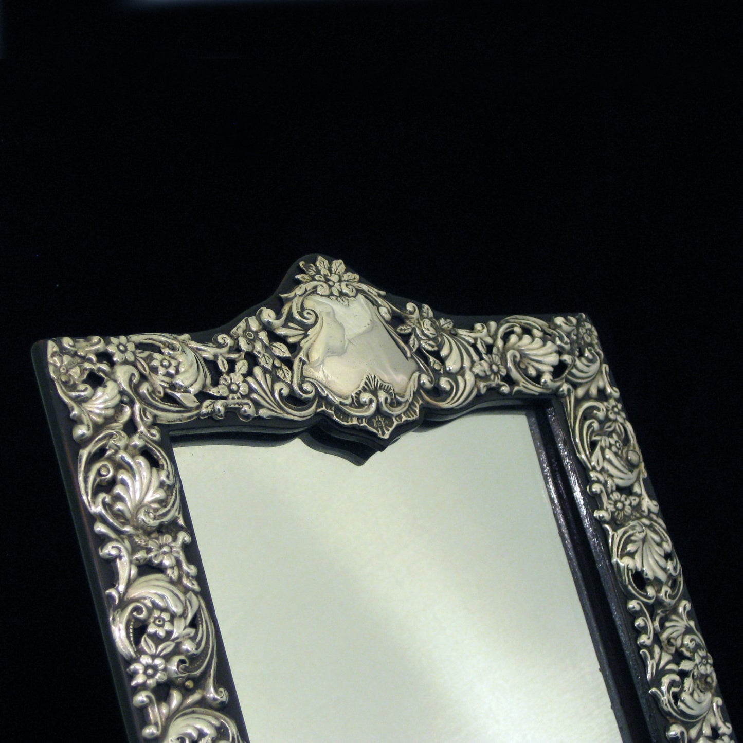 Sterling silver ornate table mirror/picture frame.