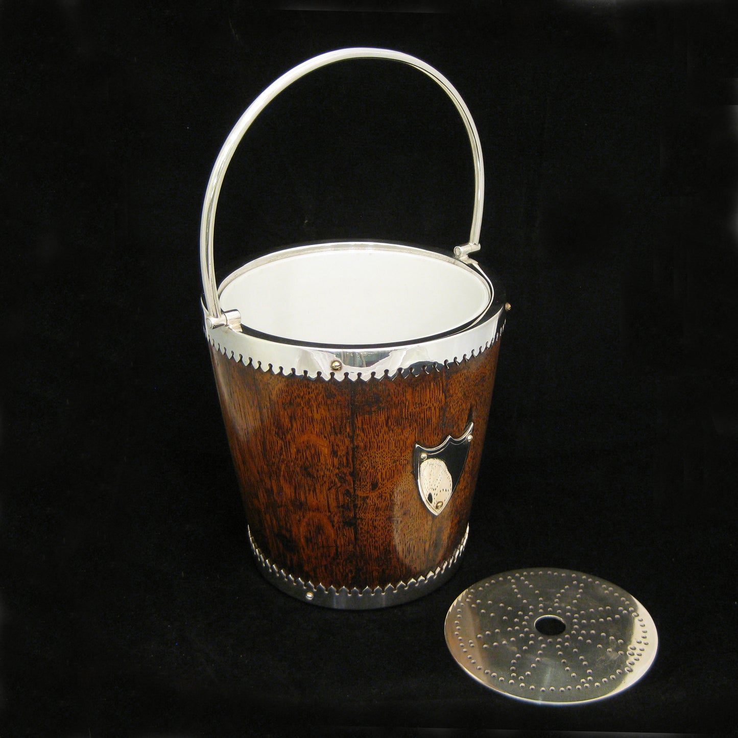 A mahogany ice bucket -cooler