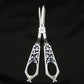 Silver grape scissors by William Hutton & sons
