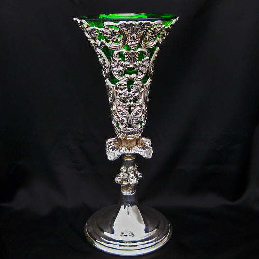 Ornate vase with bottle green fluted liner.