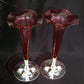 A pair of cranberry bud vases