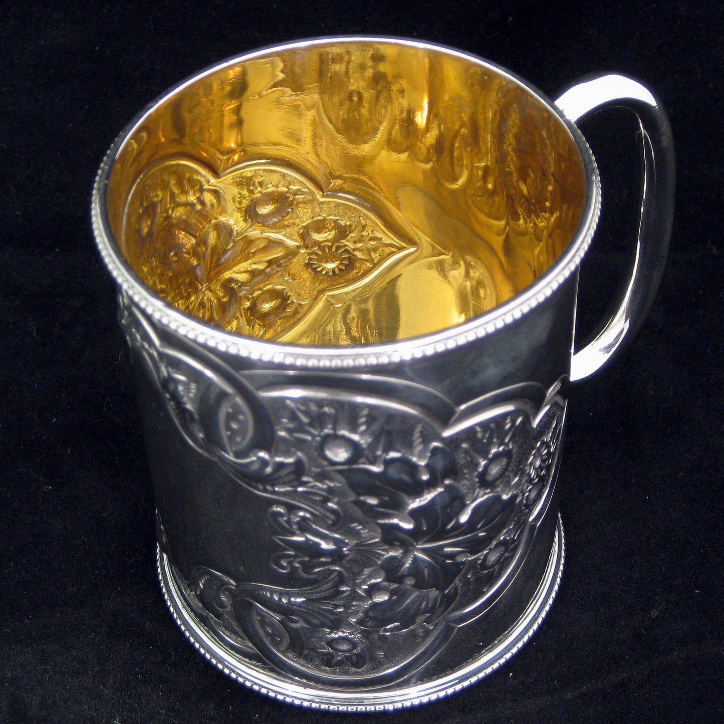 A fine quality silver embossed mug.