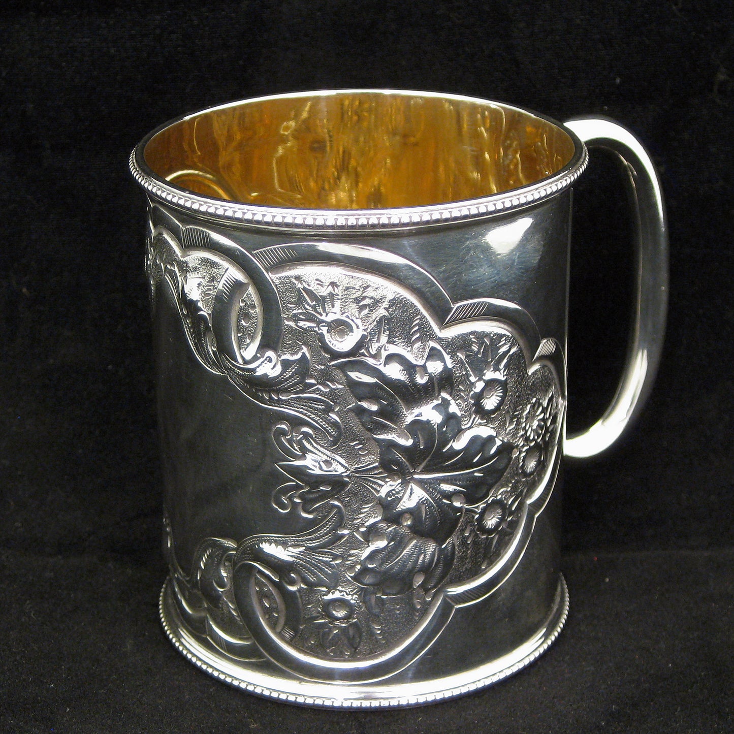 A fine quality silver embossed mug.