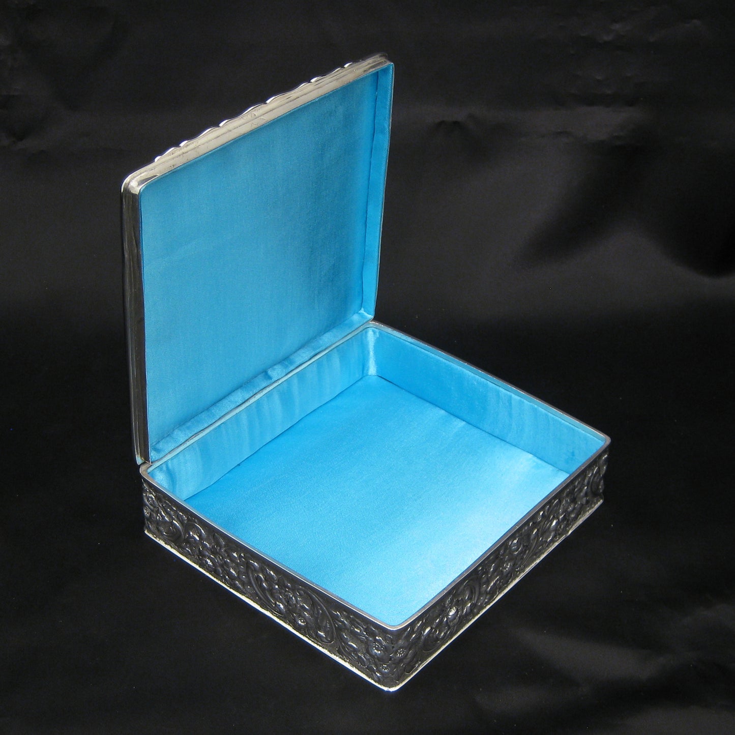 Wonderful quality chased silver jewellery box.