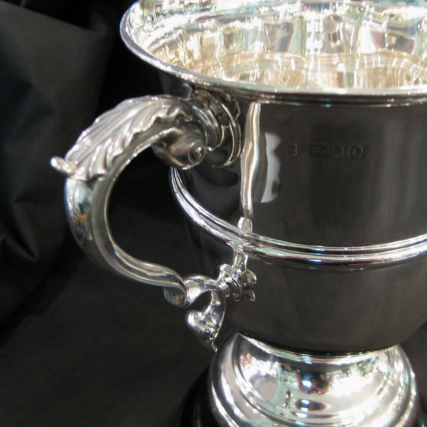 An elegant Silver Trophy on wooden base.